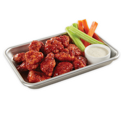 12 piece boneless chicken wings with celery and carrots.